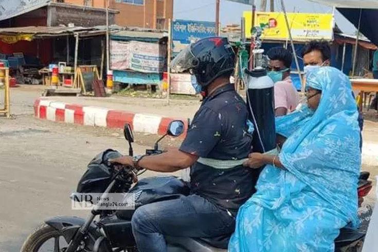 অক্সিজেন-সিলিন্ডার-নিয়ে-মোটরবাইকে