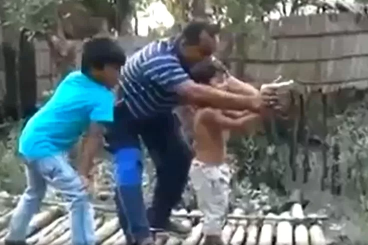 সন্তানকে ম্যাজিস্ট্রেটের গুলি ছোড়া শেখানোর ভিডিও ভাইরাল